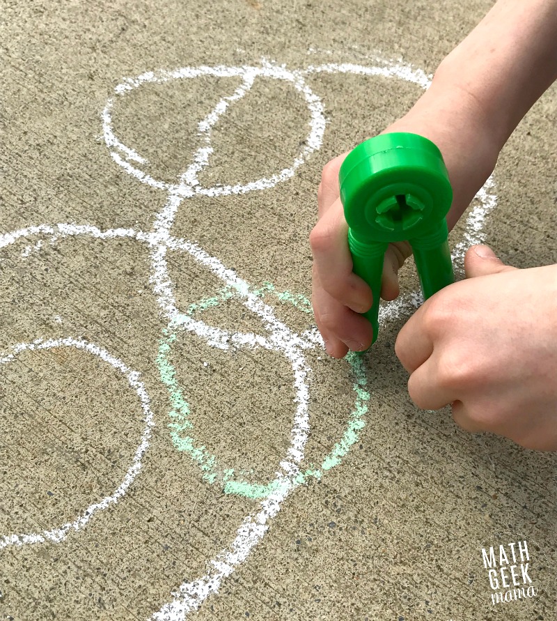 Looking for a fun, yet super simple way to engage your kids this Pi Day? This Pi Day art project is just as fun with paper and colored pencils as it is with sidewalk chalk! Learn more and get a free printable recording page in the full post!